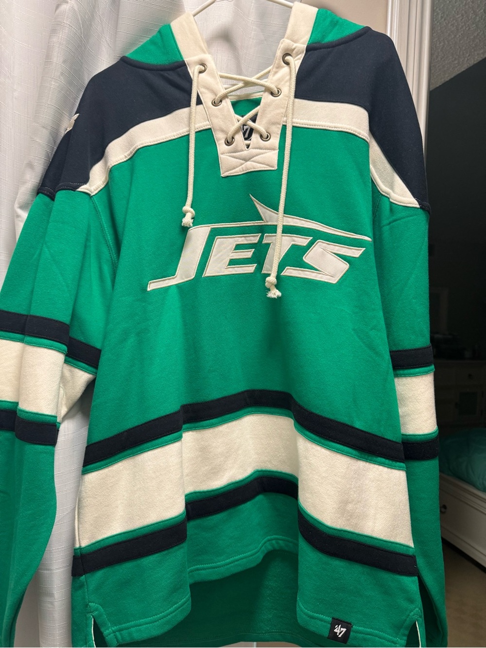 47 Green Jets Lace-Up V-Neck Hockey Sweater with White and Navy Accents